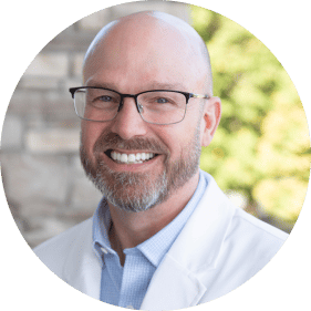 Dr. Gray, endodontist in Rochester, smiling at the camera.
